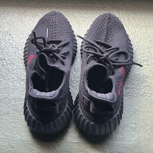 Black Sneakers with Red Accents